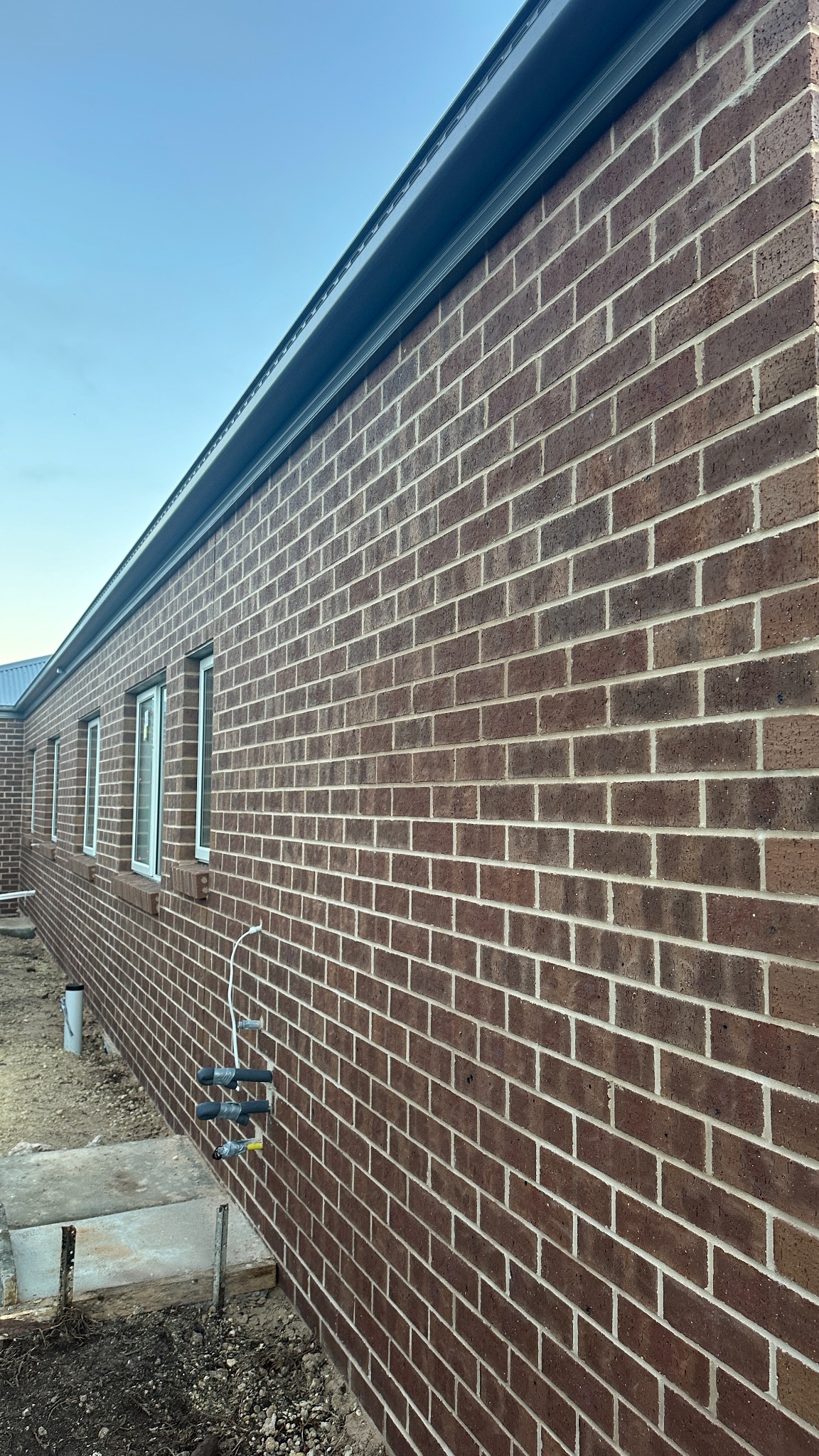 Straight red brick side wall