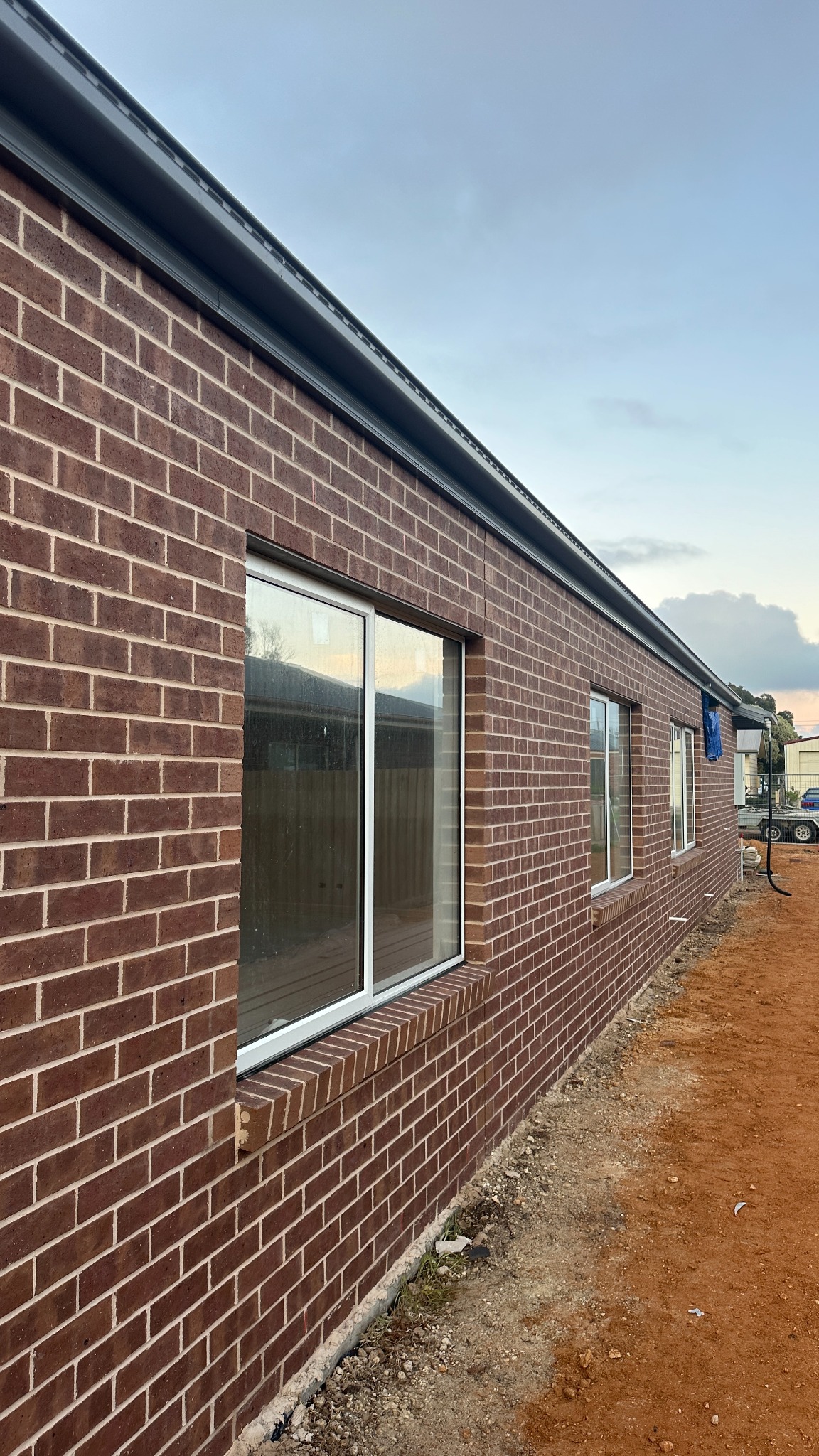Straight red brick wall and window details